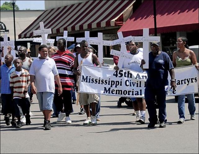 Marchers carry crosses with names of Civil Rights Era murder vicitms during the 45th Annual Mississippi Civil Rights Martyrs Memorial Service and Conference March for Justice in Philadelphia, Mississippi on June 21, 2009. (Brian Livingston/Meridian Star)